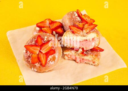 Strawberry pie brioche gourmet doughnuts with custard filling inside Stock Photo
