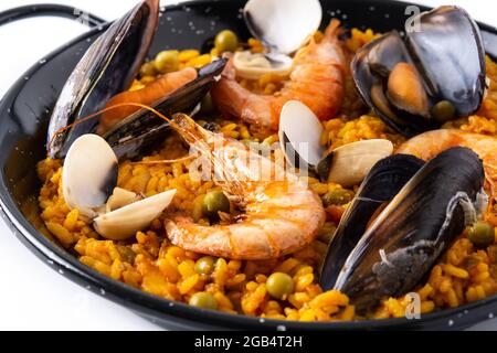 Traditional spanish seafood paella isolated on white background Stock Photo