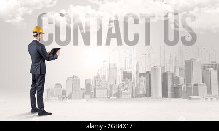 Young businessman with hard hat Stock Photo