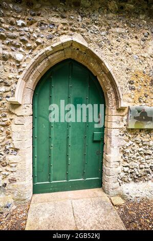 Saint Marys chuch green wooden door to the entrance of the church Stock Photo