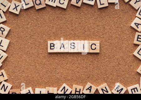 BASIC word written on wood block. BASIC text on wooden table. Business Concept Stock Photo
