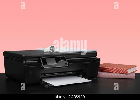 Compact home laser printer against pink background Stock Photo