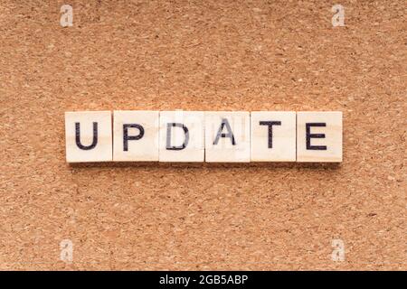 UPDATE word written on wood block. UPDATE text on wooden table. Business Concept Stock Photo