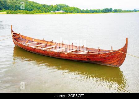 Small Viking boat karve by the river shore Stock Photo - Alamy