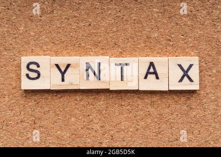 SYNTAX word written on wood block. SYNTAX text on wooden table. Business Concept Stock Photo
