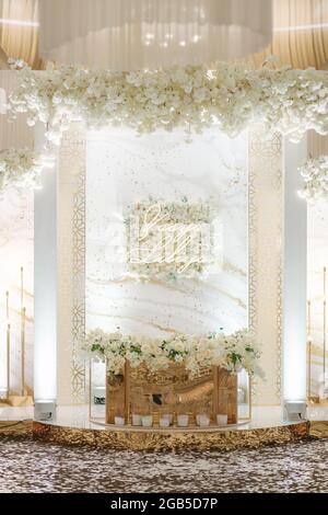 Luxury decoration on wedding table in restaurant. Broom and bride table with natural flowers Stock Photo