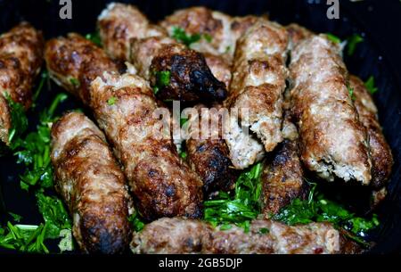 Arabic cuisine traditional food beef  Kofta and kebab charcoal grilled with green parsley on it, oriental grilled barbecued food Stock Photo