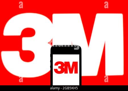 In this photo illustration a 3M Company logo seen displayed on a smartphone and in the background. Stock Photo