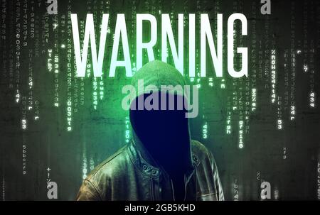 Faceless hacker with inscription Stock Photo
