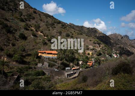 Los Loros with the orange holiday home La Era Vieja is situated at the high end of Valle Hermoso at La Gomera in Canary Islands archipelago. Stock Photo