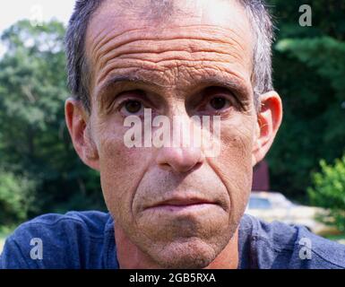 A Close Up of a Middle Aged Male's Facial Expression Stock Photo