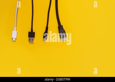 USB wires on a yellow background Stock Photo