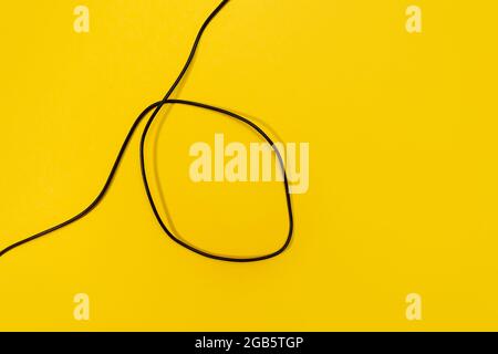 USB wires on a yellow background Stock Photo