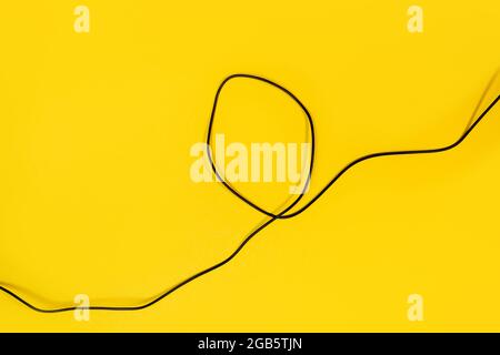 USB wires on a yellow background Stock Photo