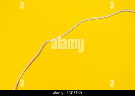 USB wires on a yellow background Stock Photo