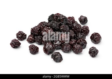 Heap sweet red dried cherries close up isolated on white background Stock Photo