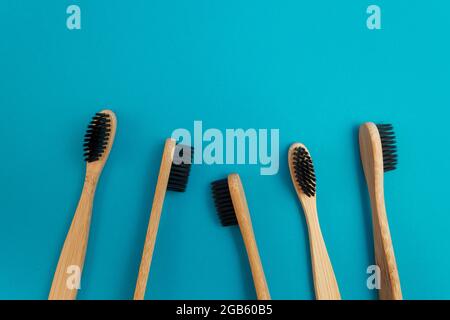 Wooden toothbrush on blue background Stock Photo