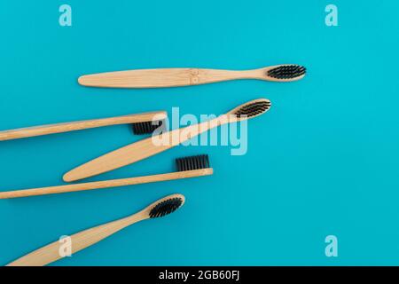Wooden toothbrush on blue background Stock Photo