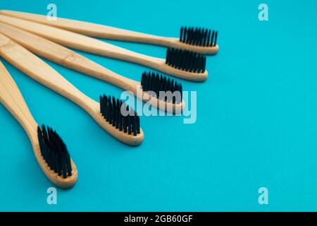 Wooden toothbrush on blue background Stock Photo