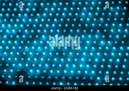 cheap outdoor blue led screen panel with individual diodes, full frame close-up view with selective focus. Stock Photo