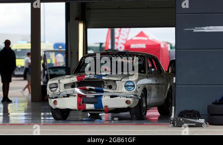 Front end damage to Dave Coynes, White, 1965, Ford Mustang after the Transatlantic Trophy Race for Pre-66 Touring Cars at the 2021 Silverstone Classic Stock Photo