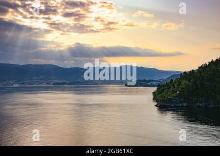 Beautiful sunrise over the city of Bergen with sunlight shining over the clouds, Bergen, Norway, Baltic cruise on the North Sea. Stock Photo