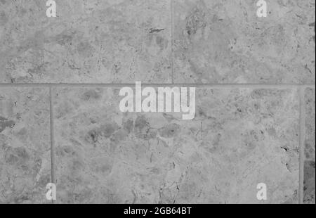 Full frame grey beige tiled marble background with rock detail Stock Photo