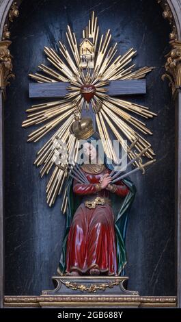 VIENNA, AUSTIRA - JUNI 17, 2021: The  Virgin Mary of seven sorrow carved statue in baroque church  Alserkirche. Stock Photo