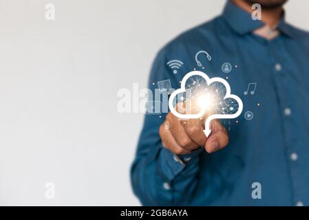 Businessman holding a cloud data icon with light. Computing data on network. Insurance Business computer security concept. Stock Photo