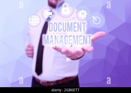 Inspiration showing sign Document Management, Word for Computerized management of electronic documents Gentelman Uniform Standing Holding New Futurist Stock Photo
