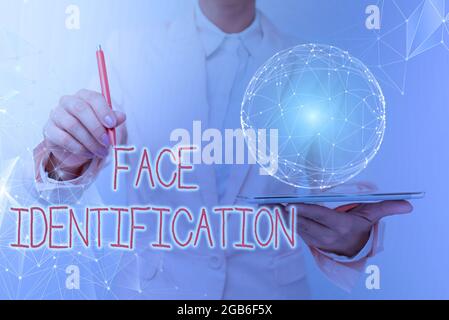 Conceptual display Face Identification. Word Written on analyzing patterns based on the person s is facial contours Woman In Suit Holding Tablet With Stock Photo