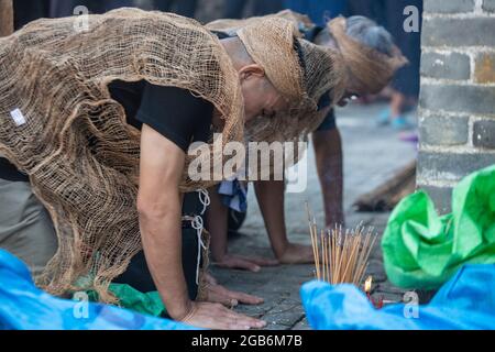 Mourners at a funeral in a rural village in China Stock Photo