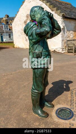 The Watcher, a life sized bronze sculpture by Kenny Hunter, at the Scottish Seabird Centre in North Berwick, Scotland, UK Stock Photo