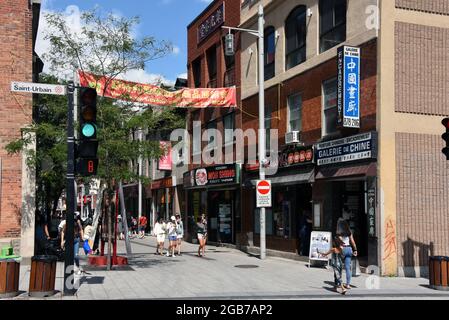 Montreal, Canada - July 31, 2021: Rue De La Gauchetière and Saint-Urbain in the Chinatown area of Old Montreal. Stock Photo