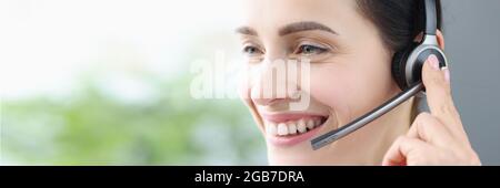 Portrait of smiling woman with headphones and microphone Stock Photo