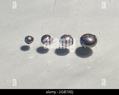 raw Rhodium metal sample, rhoduim is very strong but brittle in pure form so makes it perfect for coating jewellry here is a recycled piece extracted Stock Photo
