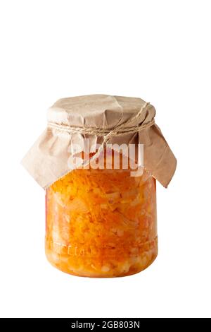 Sauerkraut in a glass jar isolated on a white background. Fermented trending food. Homemade preserves. Stock Photo