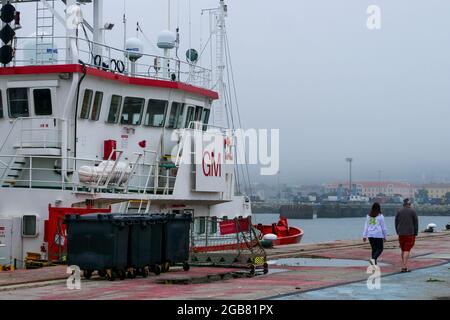 Passers-by on a disused quay, Cherbourg harbor, Manche department, Cotentin, Normandy, France Stock Photo