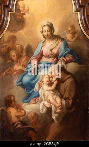 VIENNA, AUSTIRA - JULI 5, 2021: The detail of painting of Holy Family in the church Kapuzinerkirche by capuchin Norbert Baumgartner from  18. cent.. Stock Photo