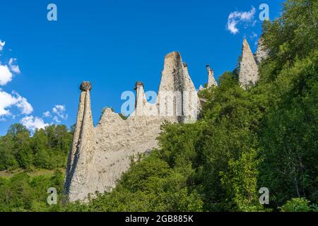 The natural earth pyramids of Euseigne in the valley of Herens are one of Switzerland's most important geological sights. Stock Photo