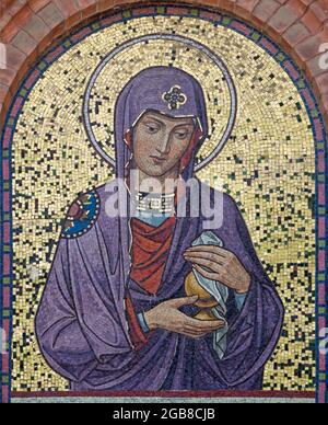 VIENNA, AUSTIRA - JULI 5, 2021: The mosaic of St. Mary Magdalen on the facade of St. Anthony church from begin of 20. cent.. Stock Photo