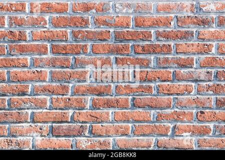 Red weathered stained brick wall. Background texture Stock Photo