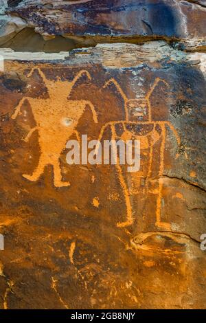 Spectacular panel of stylized human figures at McKee Spring Petroglyph Site, Dinosaur National Monument on border of Utah and Colorado, USA [color add Stock Photo