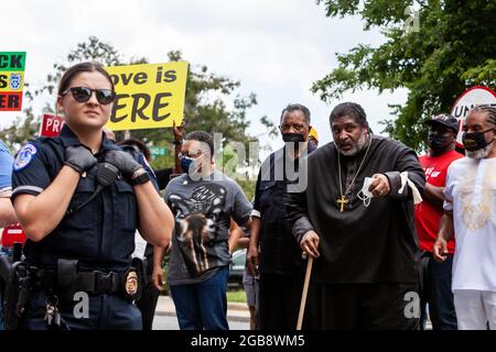 Washington, DC, USA, 2 August 2021.  Pictured: Rev. Jesse Jackson and Rev. William Barber await arrest during a in civil disobedience action on Constitution Avenue.  the Moral Monday March was sponsored by the Poor People’s Campaign, Kairos Center, and Repairers of the Breach.  Credit: Allison Bailey / Alamy Live News Stock Photo