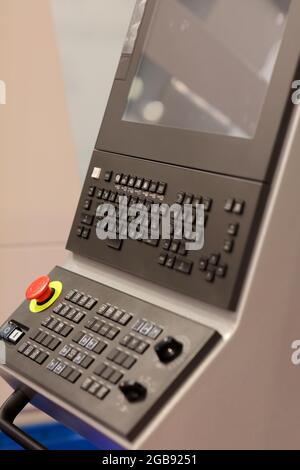 Modern CNC control console with touch screen. Selective focus. Stock Photo