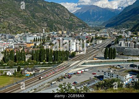 Industrial town of Visp with railway station, Valais, Switzerland Stock Photo