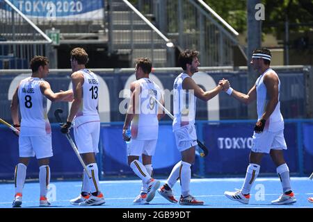 Belgium's players celebrate after winning a semi-final hockey match between Belgium's Red Lions and India, in the men's field hockey tournament, on da Stock Photo