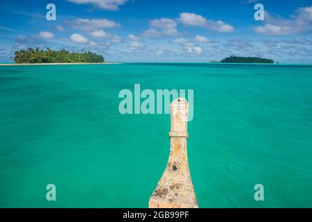 Traditional wood carved boat in the Aitutaki lagoon, Rarotonga and the Cook islands Stock Photo