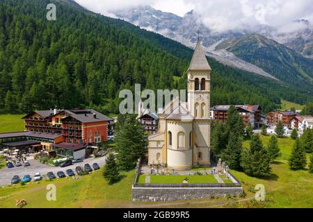 Aerial view, St. Gertaud's parish church, Parc hotel on the left, Ortler massif in the background, Sulden mountain village, Solda, district of the Stock Photo