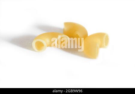 Three macaroni isolated on a white background. Macro.  Stock Photo